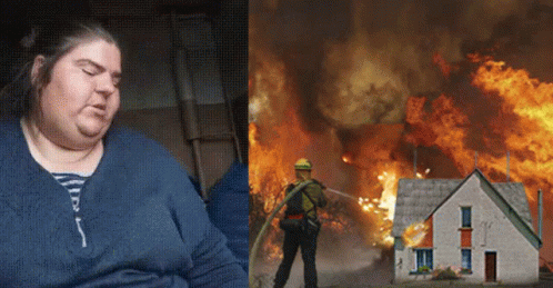 A Woman Is Sitting Next To A Picture Of A Fireman Spraying Water On A Burning House GIF