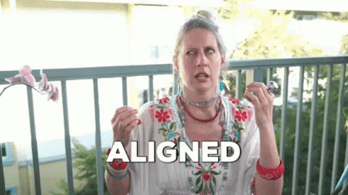 A Woman Is Sitting On A Balcony And The Word Aligned Is Above Her Head GIF