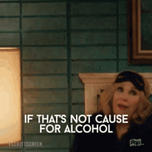 A Woman Is Sitting On A Bed And Says If That 'S Not Cause For Alcohol . GIF
