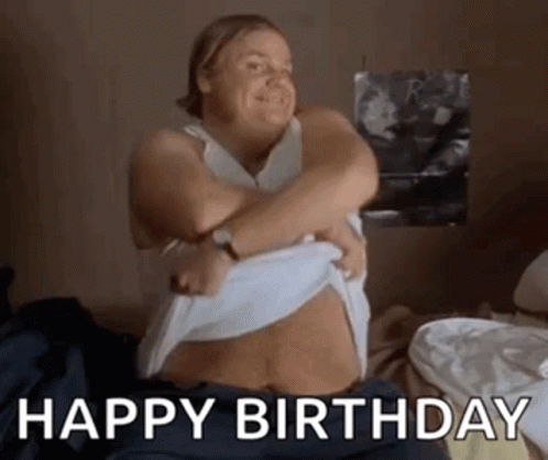 A Woman Is Sitting On A Bed With Her Arms Around Her Stomach . GIF