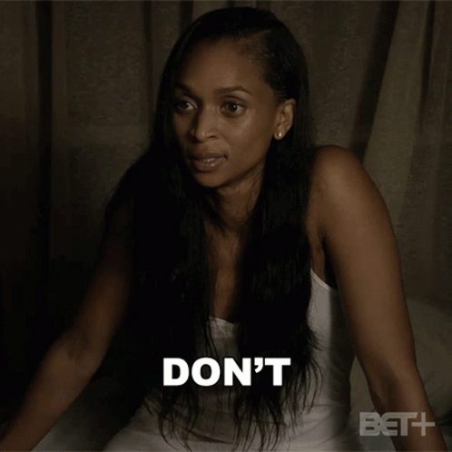 A Woman Is Sitting On A Bed With The Words " To Our Conversation " Behind Her GIF