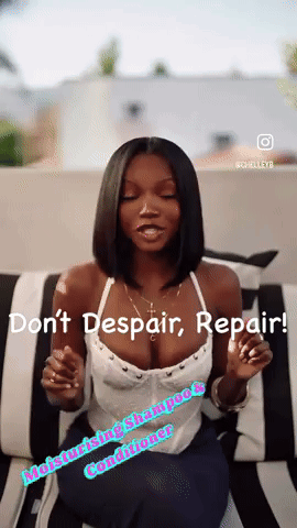 A Woman Is Sitting On A Black And White Striped Couch With The Words " Do N't Despair Repair " On The Bottom GIF
