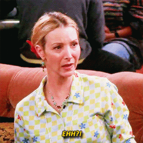 A Woman Is Sitting On A Couch And Says " Ehh ? " GIF