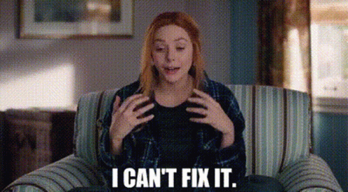 A Woman Is Sitting On A Couch And Says `` I Can 'T Fix It '' . GIF