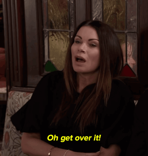 A Woman Is Sitting On A Couch And Says Oh Get Over It GIF
