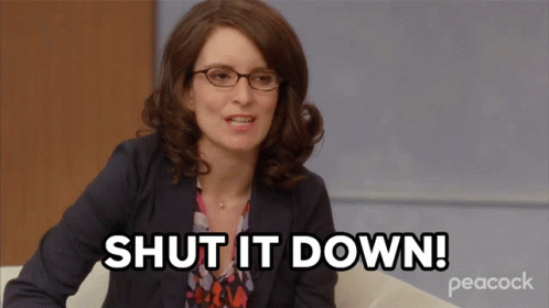 A Woman Is Sitting On A Couch And Says Shut It Down GIF
