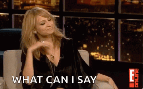 A Woman Is Sitting On A Couch In Front Of A Window And Saying What Can I Say . GIF