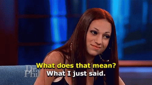 A Woman Is Sitting On A Couch Talking About What Does That Mean . GIF