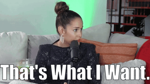 A Woman Is Sitting On A Couch Talking Into A Microphone And Says That 'S What I Want . GIF