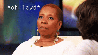 A Woman Is Sitting On A Couch Talking To Another Woman And The Words " Oh Lawd " Are Above Her GIF