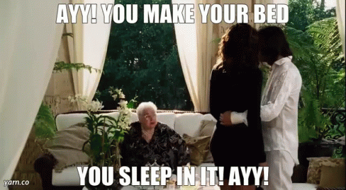 A Woman Is Sitting On A Couch With A Man And A Woman . GIF