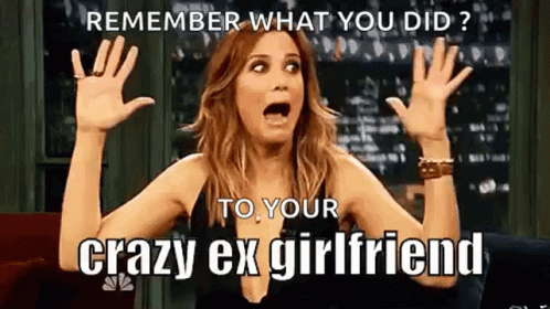 A Woman Is Sitting On A Couch With Her Hands In The Air And A Meme . GIF