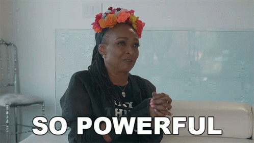 A Woman Is Sitting On A Couch With The Words So Powerful Behind Her GIF