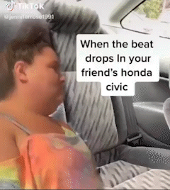 A Woman Is Sleeping In The Back Seat Of A Honda Civic GIF