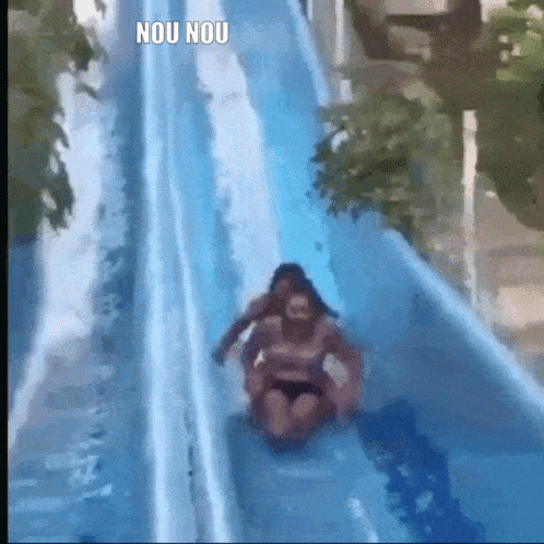 A Woman Is Sliding Down A Water Slide With The Words Nou Nou Written On The Bottom GIF