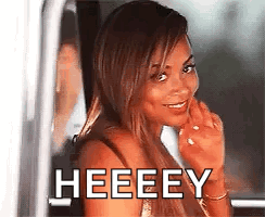 A Woman Is Smiling And Looking Out Of A Car Window With The Words Heeeey Written On It . GIF