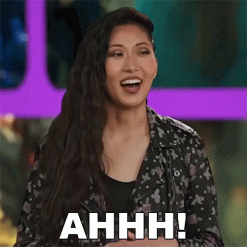 A Woman Is Smiling And Saying Ahhh ! GIF