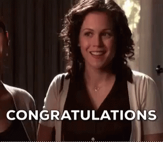 Woman Smiling And Saying Congratulations Next To Another Woman GIF