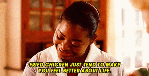 A Woman Is Smiling And Saying Fried Chicken Just Tend To Make You Feel Better About Life . GIF