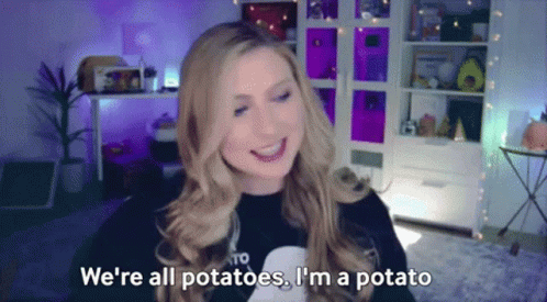 A Woman Is Smiling And Saying We 'Re All Potatoes . I 'M A Potato . GIF