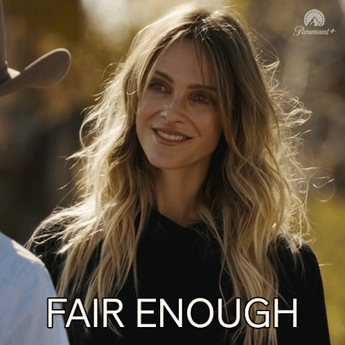 A Woman Is Smiling And Says Fair Enough GIF