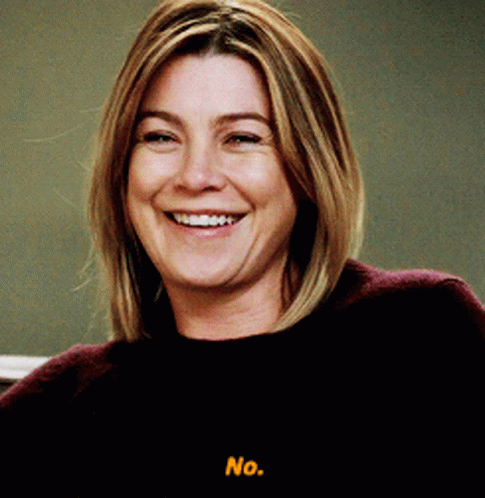 A Woman Is Smiling And Says No In Yellow GIF