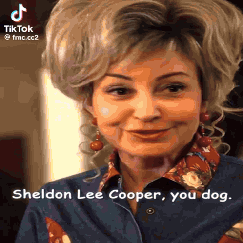 A Woman Is Smiling And Says Sheldon Lee Cooper Your Dog GIF