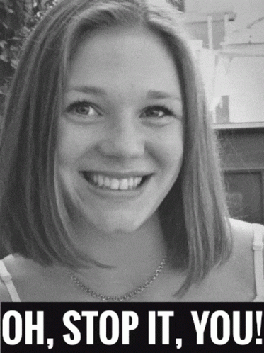 A Woman Is Smiling In A Black And White Photo With The Words Oh Stop It You GIF