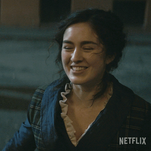 A Woman Is Smiling In A Netflix Advertisement GIF