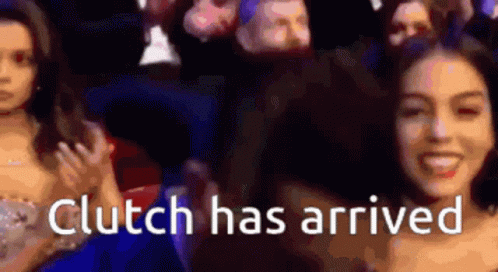 A Woman Is Smiling In Front Of A Crowd With The Words " Clutch Has Arrived " GIF