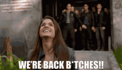Woman Smiling And Saying We're Back Bitches GIF