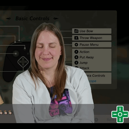 A Woman Is Smiling In Front Of A Screen That Says " Basic Controls " On It GIF