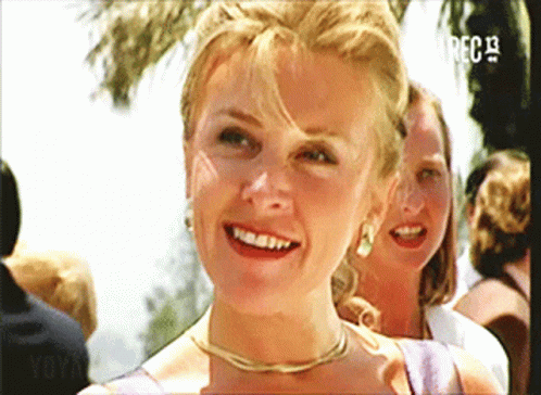 A Woman Is Smiling In Front Of A Screen That Says ' Rec 13 ' GIF