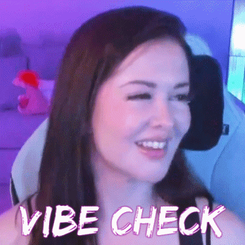 A Woman Is Smiling While Sitting In A Chair With The Words `` Vibe Check '' Written Above Her . GIF