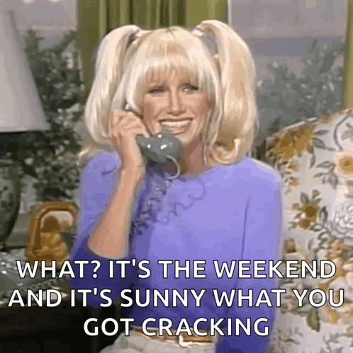 A Woman Is Smiling While Talking On A Phone And Says What It 'S The Weekend And It 'S Sunny GIF