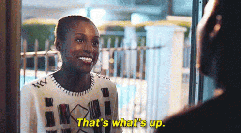 A Woman Is Smiling While Talking To A Man And Says `` That 'S What 'S Up . '' GIF