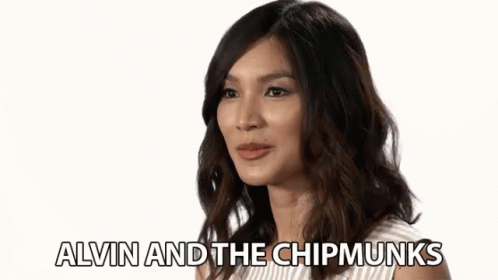 A Woman Is Smiling With The Words Alvin And The Chipmunks Written Below Her GIF