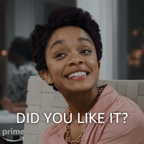 A Woman Is Smiling With The Words " Did You Like It " Behind Her GIF