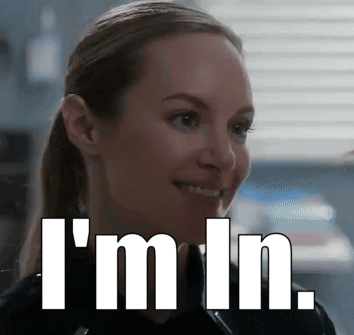 A Woman Is Smiling With The Words I 'M In Written Below Her GIF
