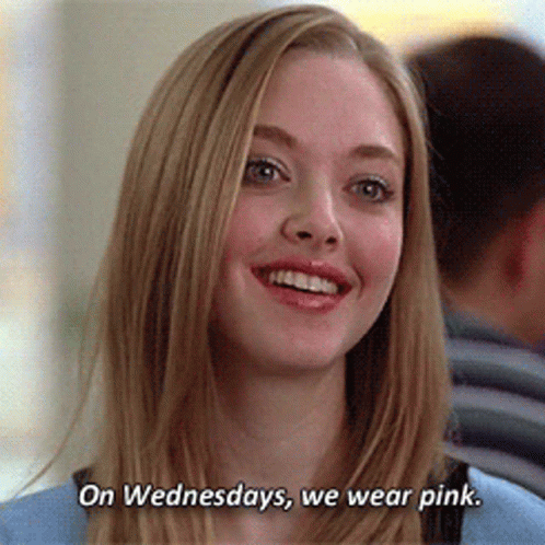 A Woman Is Smiling With The Words On Wednesdays We Wear Pink GIF