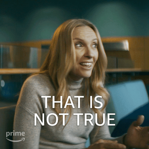 A Woman Is Smiling With The Words That Is Not True Above Her GIF