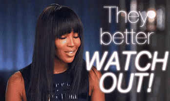 A Woman Is Smiling With The Words " They Better Watch Out " Behind Her GIF