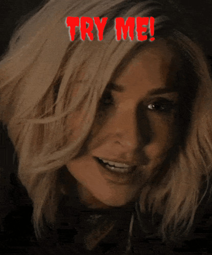 A Woman Is Smiling With The Words Try Me Above Her Head GIF