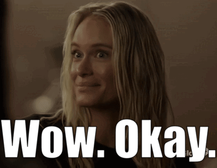 A Woman Is Smiling With The Words Wow Okay Written Below Her GIF