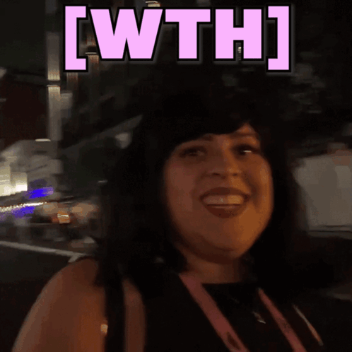 a woman is smiling with the words [ wth ] above her