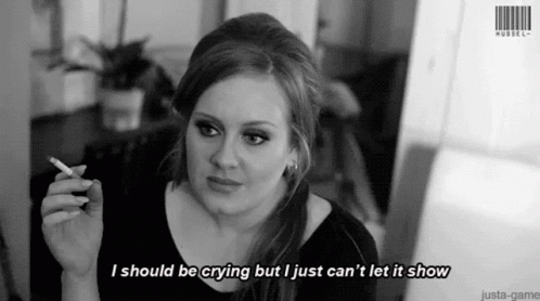 A Woman Is Smoking A Cigarette And Says I Should Be Crying But I Just Can 'T Let It Show . GIF