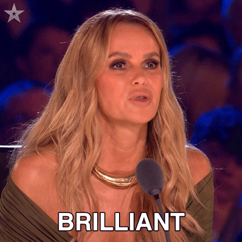 A Woman Is Speaking Into A Microphone And The Word Brilliant Is On The Screen Behind Her GIF