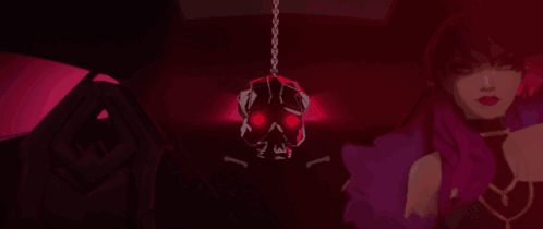 A Woman Is Standing In A Dark Room With A Skull Hanging From The Ceiling GIF