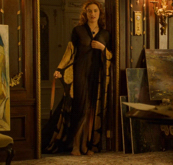 A Woman Is Standing In A Doorway With A Clock On The Wall That Says ' Clock ' On It GIF