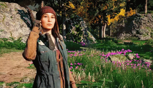 A Woman Is Standing In A Field Of Flowers In A Video Game Holding A Gun . GIF